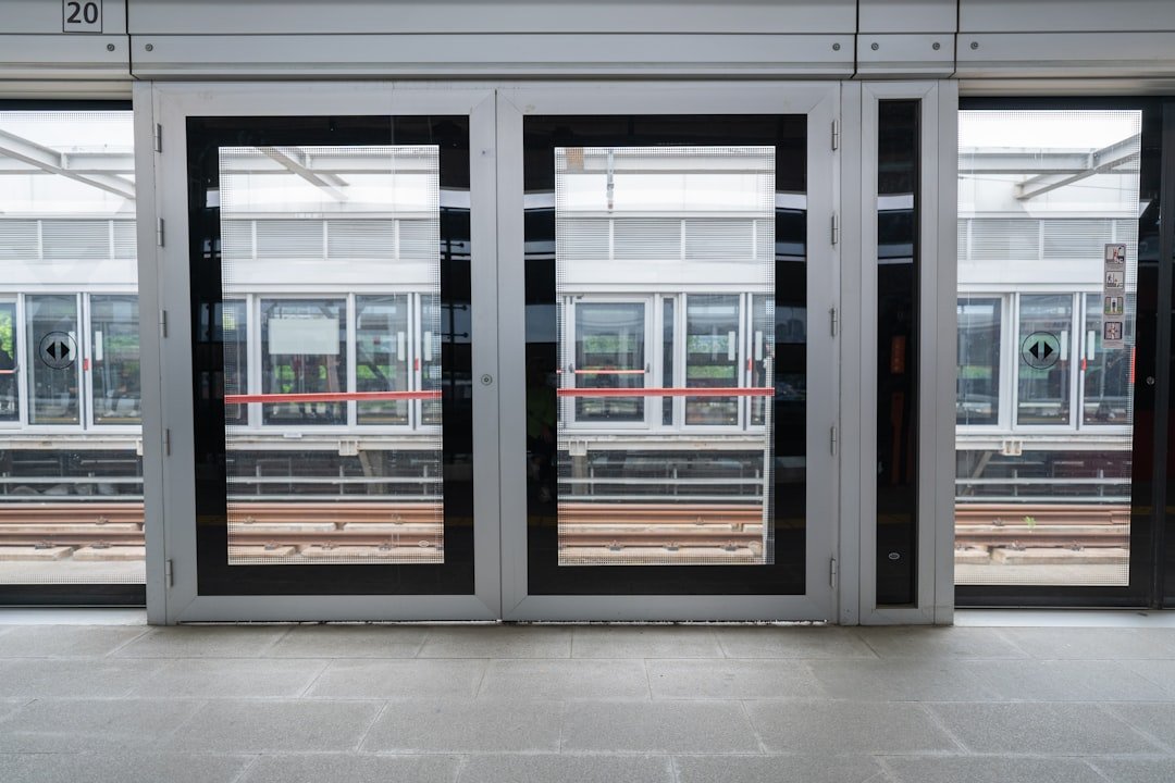 an-empty-train-station-with-two-doors-open-tkx6mus-i1y